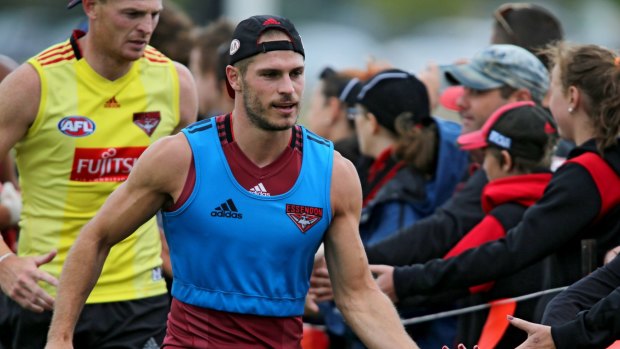 David Zaharakis and Brendon Goddard greet fans at the Bombers' first practice session after the verdict from the Court of Arbitration for Sport.