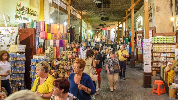 Tourists and visitors stroll through the Street Market in Deira. 