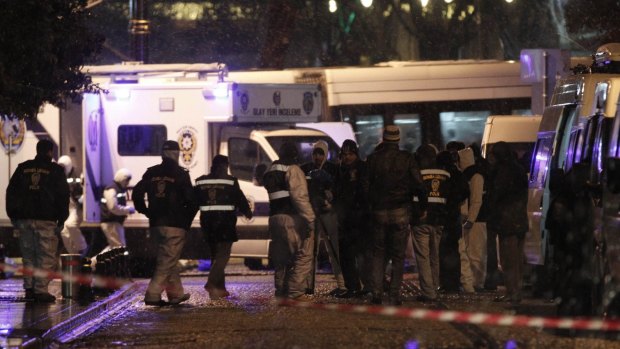 Forensic officers work at the scene of a bomb blast in Istanbul.