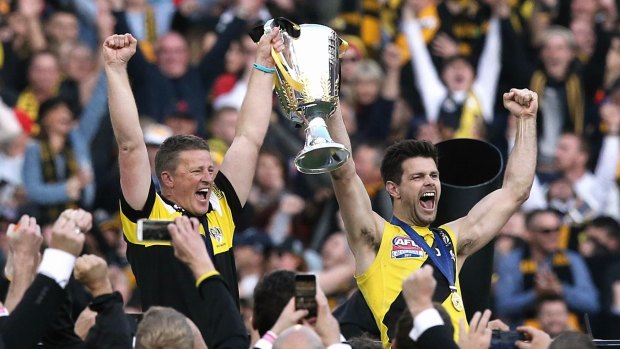 Dream come true: Damien Hardwick and Trent Cotchin are the toast of the MCG.