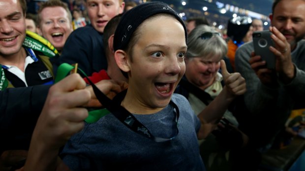 Happiest kid in the world: Charlie Line is all smiles after being given the medal by Sonny Bill Williams.