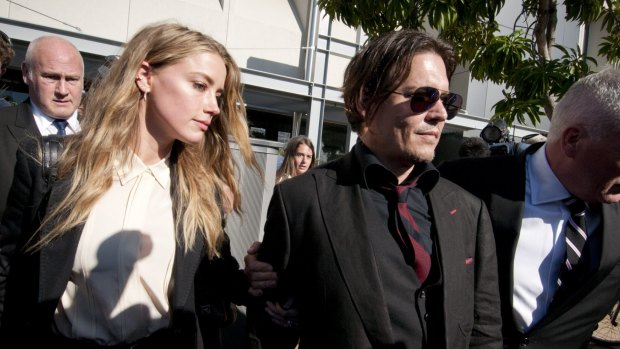 Depp leaving Southport Magistrates Court, Queensland, with Heard in April after she pleaded guilty to falsifying travel documents to sneak her dogs into Australia.