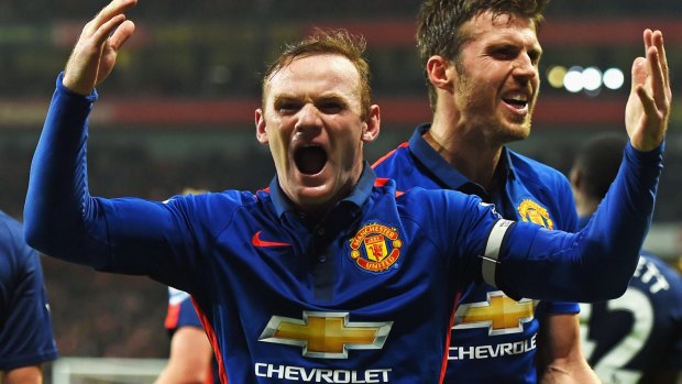 Wayne Rooney celebrates scoring Manchester United's second goal against Arsenal.