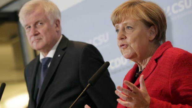 German Chancellor Angela Merkel, right, and the Governor of the State of Bavaria, Horst Seehofer.