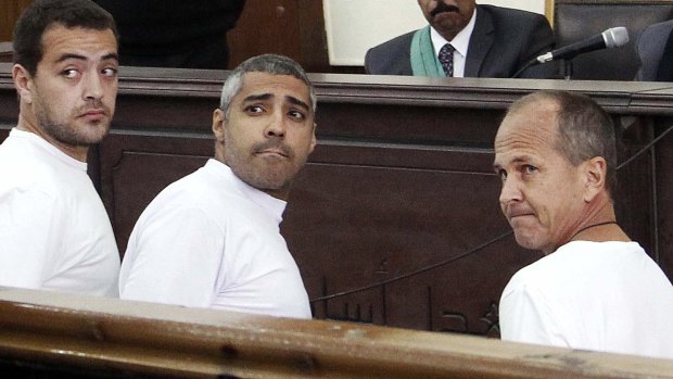 Journalists Baher Mohamed and Mohammed Fahmy, with Peter Greste, during a court appearance in Cairo in January.