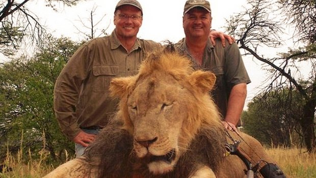 Walter Palmer, left, poses with the corpse of Cecil the lion. Cecil's death in 2015 reignited the debate over trophy hunting and conservation in Zimbabwe.