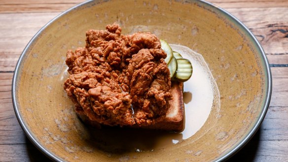 Buttermilk fried chicken with spicy sauce.