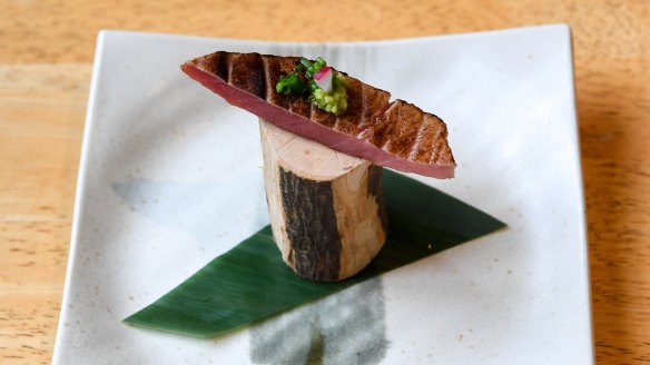 Otoro (tuna belly) served on a log.