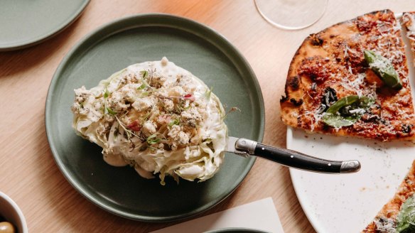 A wedge salad is one of the simple sides that lets the pizza do the talking.