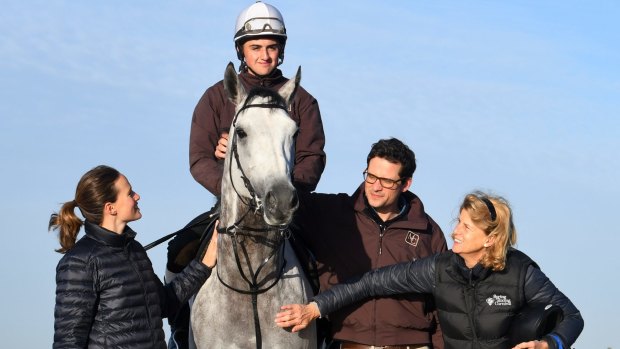 Matt Cumani poses with his Melbourne Cup runner Grey Lion with sister Francesca Cumani and mother Sarah Cumani and rider Bastion Neuhaus after a trackwork session.