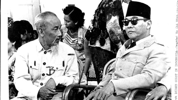 Ho Chi Minh President of Communist-ruled North Vietnam chats with Indonesian president Ahmed Sukarno at an outdoor party in Tjipanas during the communist leader's state visit to Indonesia in 1959. 