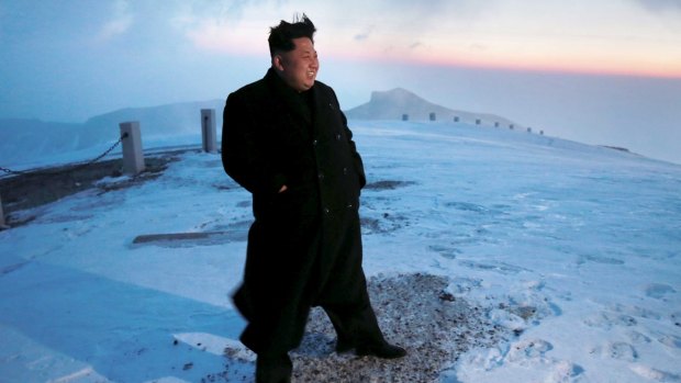 North Korean leader Kim Jong-Un views the dawn from the summit of Mt Paektu.