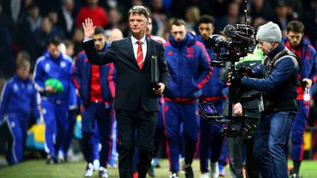 Louis van Gaal, manager of Manchester United, waves to the crowd.