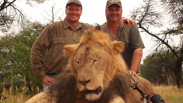 Walter Palmer, left,  poses with the corpse of Cecil the lion. Cecil's death reignited the debate over trophy hunting and conservation in Zimbabwe.