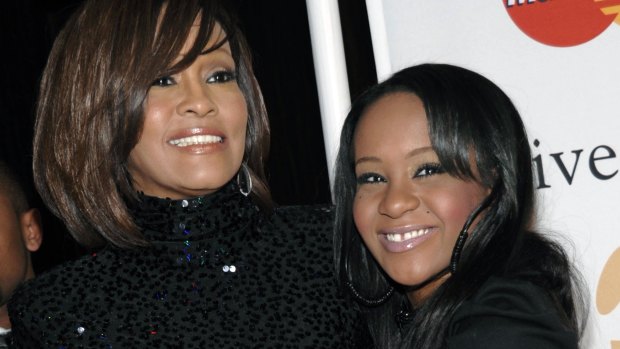 Singer Whitney Houston, left, and daughter Bobbi Kristina Brown arrive at an event in Beverly Hills.