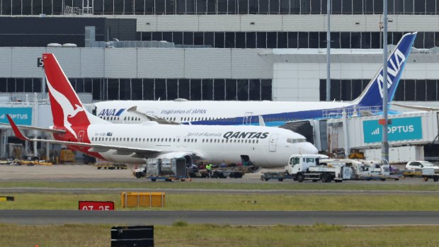 Qantas flight QF144 at Sydney Airport on Wednesday. The flight landed safely after a mayday call due to an engine failure mid-flight from Auckland.