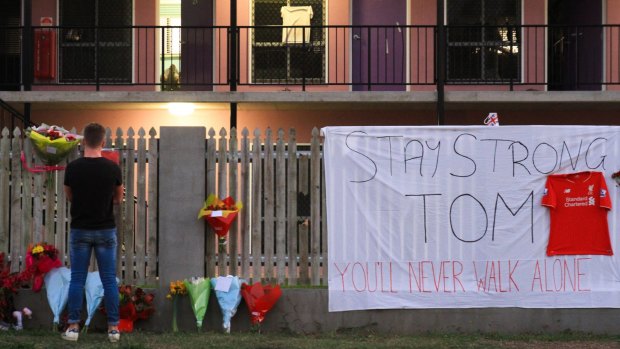Tributes to victims Mia Ayliffe-Chung and Thomas Jackson were set up out front of the backpackers hostel.