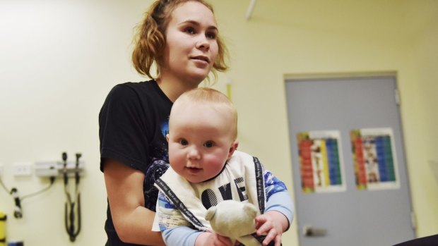  Kiara Bloxsome, and her six-month-old son Carter, whose family have been patients of the  Mount Druitt Aboriginal Medical Service for four generations. The service has lost funding.