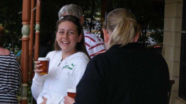 Shannon McKnight, who died from cancer when she was 19, enjoys a trip to a cafe.