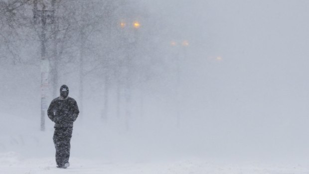 Trying conditions: A man walks through a white-out in Boston, Massachusetts.