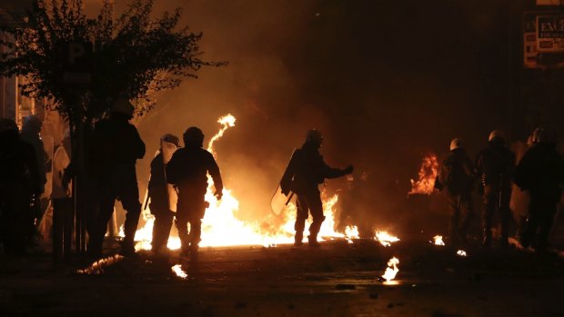 Riots broke out in central Athens, with dozens of youths throwing petrol bombs at police.