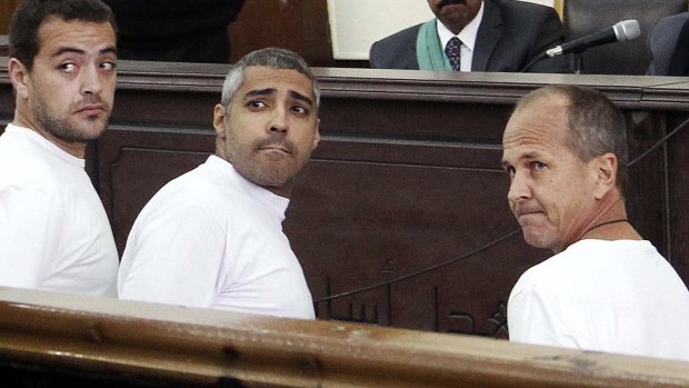 'It is not enough': Peter Greste with his al-Jazeera English colleagues Baher Mohamed, left, and Mohamed Fahmy in court in Cairo in March 2014. Fahmy's release to Canada has been widely anticipated.