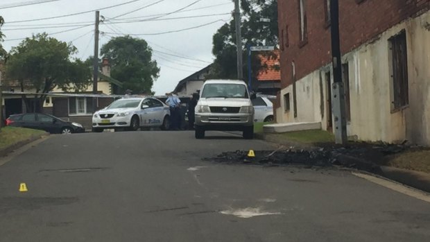 The getaway car used in the shooting at Mortlake on Friday morning was found burnt out in an industrial area in Belmore in Sydney's south west.