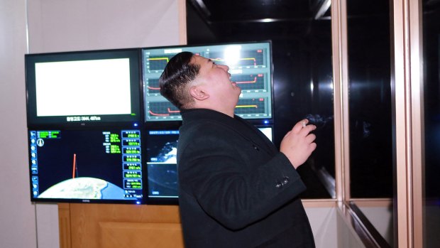 North Korean leader Kim Jong-un appears to watch the launch of a missile on Wednesday.