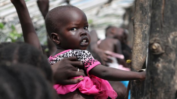 A baby in the queue for food at a camp for displaced people near the United Nations base in Juba, South Sudan. 