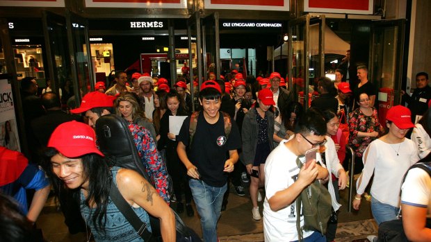 Crowds race inside the David Jones city store in the early hours of the morning on Boxing Day, 2015.