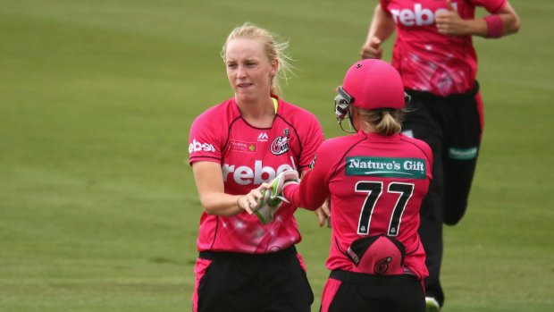 Not returning: Kim Garth is congratulated after a wicket.