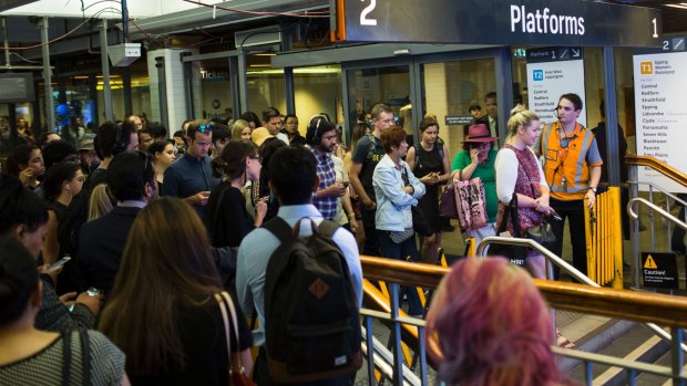 Commuters are made to wait to enter Town Hall station and its platforms due to delays caused by an accident in Wentworthville earlier on Monday. 