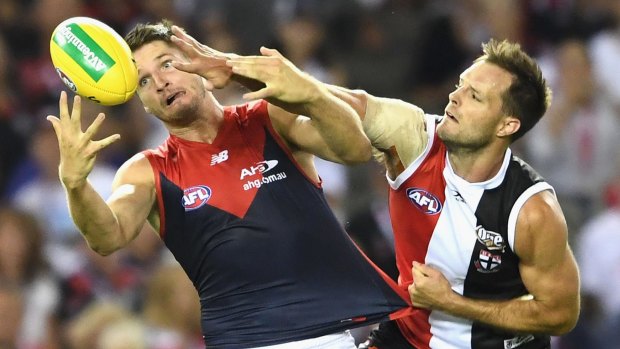 Jesse Hogan outreaches Nathan Brown in Melbourne's eyecatching win.