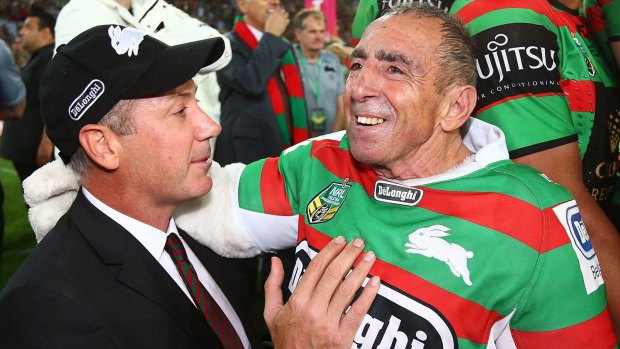 Peter Holmes A Court (L) celebrates the Rabbitohs grand final win with the mascot Reggie the Rabbit.