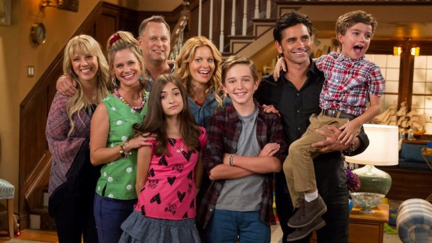 Delightful family sitcom: Fuller House cast revisits same cheesy jokes and one-liners with originals Uncle Joey (Dave Coulier), back left, and Uncle Jesse (John Stamos), right.