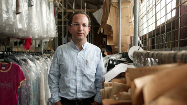 Specialty Fashion chief executive Gary Perlstein is still counting the cost of his Rivers acquisition, but losses have halved.