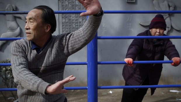 Elderly Chinese doing exercise at a public park in Beijing, China.