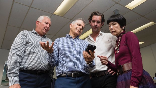 Darren Williams, Peter Lynch, Dean Farrow and Teresa Ooi at Big Splash Media are among six members of staff using one phone and without the internet due to delays in getting connected to the NBN.
