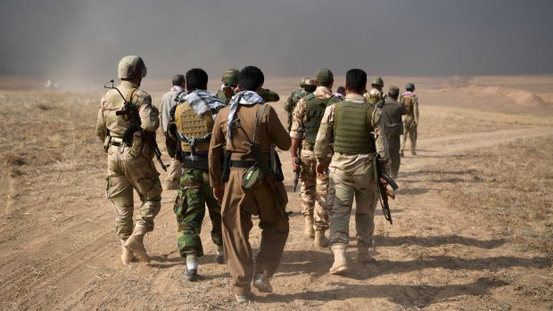 Kurdish peshmerga soldiers during an attack to recapture the village of Tiskharab, near Mosul.