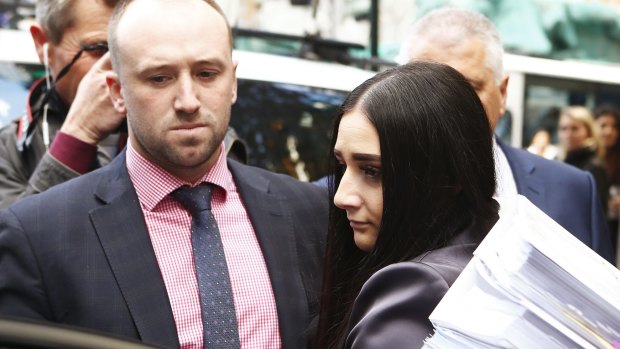 Phil Hughes' brother and sister Jason and Megan leave Downing Centre after the final day of the inquest.