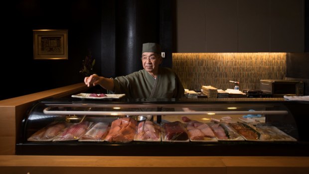 Shige Nakano behind the sushi bar.