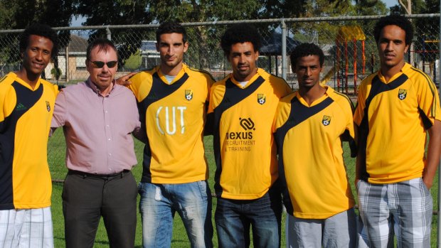 Eritrean soccer players who defected from their homeland, sought asylum in Kenya in 2009 and eventually wound up in Australia, in their new Australian club colours. Left, Samuel Gebrihiwet,
fourth from left Ermias Maekele, fifth from left Nevi Gebremeskel and sixth from left, Ambasager Sium.