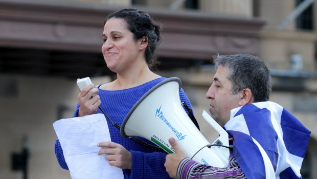 Dimitra Baveas speaks during the rally in King George Square.