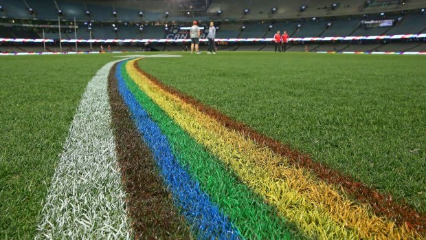 The 50-metre arcs at Etihad Stadium were painted rainbow-coloured during the the inaugural AFL Pride Game.