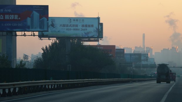 The road to Yanjiao is filled with billboards advertising residential property developments