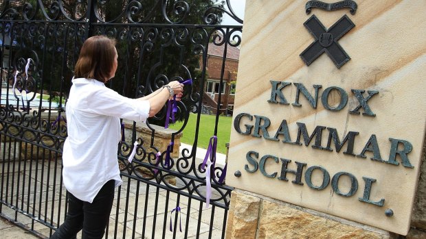 Ribbons being tied to the gates at Knox Grammar School.