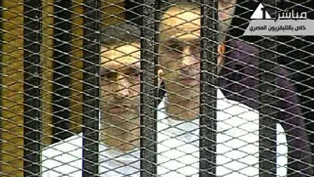 The sons of Hosni Mubarak, Alaa, left, and Gamal, in the defendants' cage in Cairo in 2011.