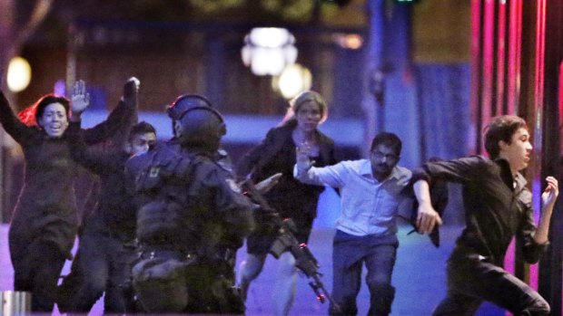 The moment five hostages fled the Lindt cafe in December 2014, where they had been captive.