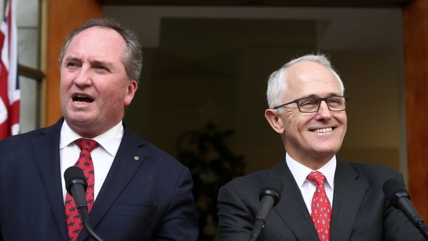 Barnaby Joyce and Malcolm Turnbull are all smiles as they announce the Greens deal on the backpacker tax.