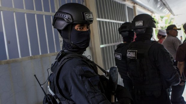 Police at Abu Bakar Bashir's trial in Cilacap, Central Java, in January.